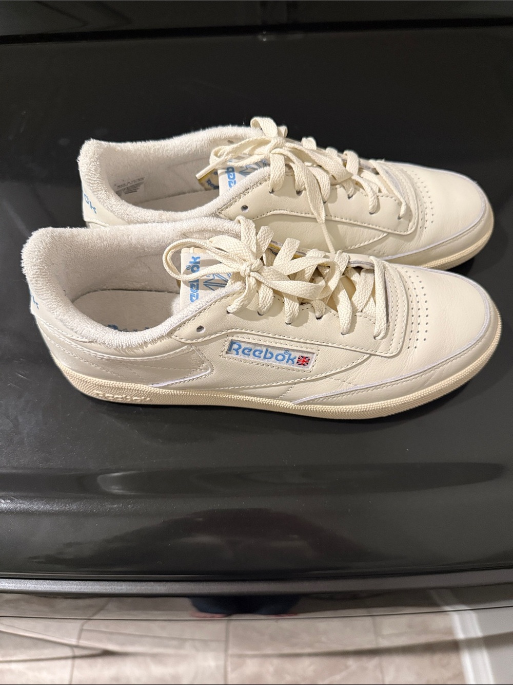 Reebok Women's Sneakers in Cream with Blue Logo